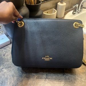 Gently used coach shoulder bag. Black with gold.